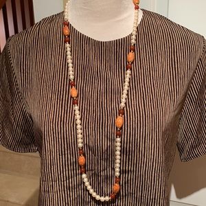 MAGGIE SWEET. Brown/Black striped shirt. Short sleeves.